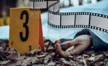 Cadavere con pellicola del cinema che gli passa sopra
