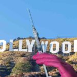 Scritta Hollywood e guanto infermiere con siringa