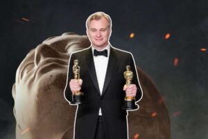 Christopher Nolan con Oscar e poster The Odyssey